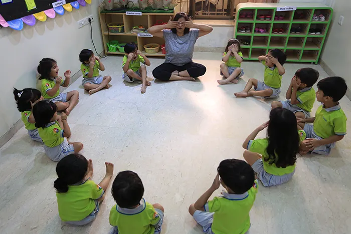 Children in a baby yoga circle at Edistää Preschool, Wadala West, Mumbai