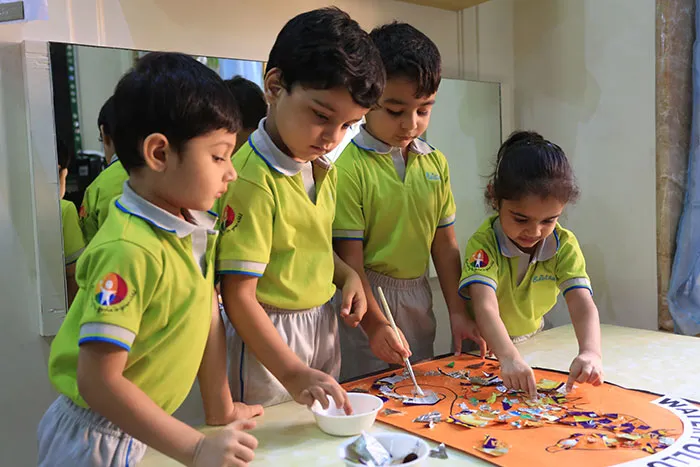 Kindergarten children solving a group puzzle at Edistää Preschool, Wadala West, Mumbai