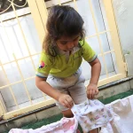 Nursery child exploring by the window at Edistää Preschool, Wadala West, Mumbai